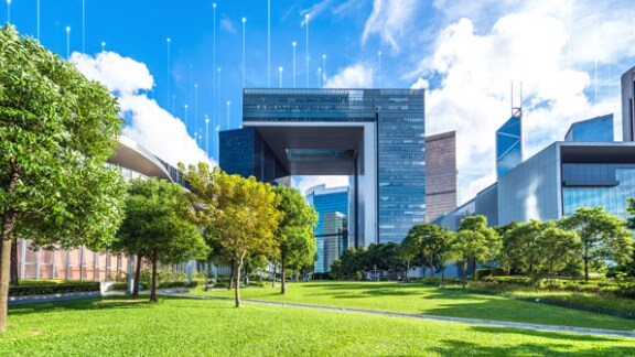 Glass building surrounded by landscape